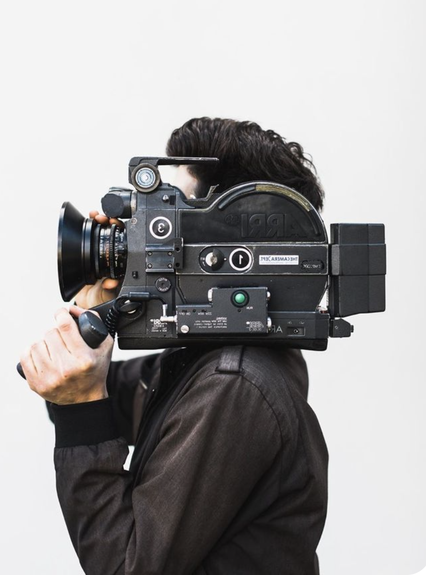 Cinematographer with a vintage film camera